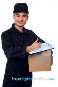 smiling-delivery-man-at-your-doorstep-100184124