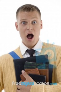 shocked-male-student-holding-books-10091893