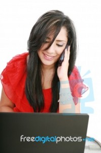 lady-with-laptop-and-phone-10096426