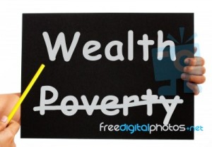pointing-wealth-on-blackboard-10097410